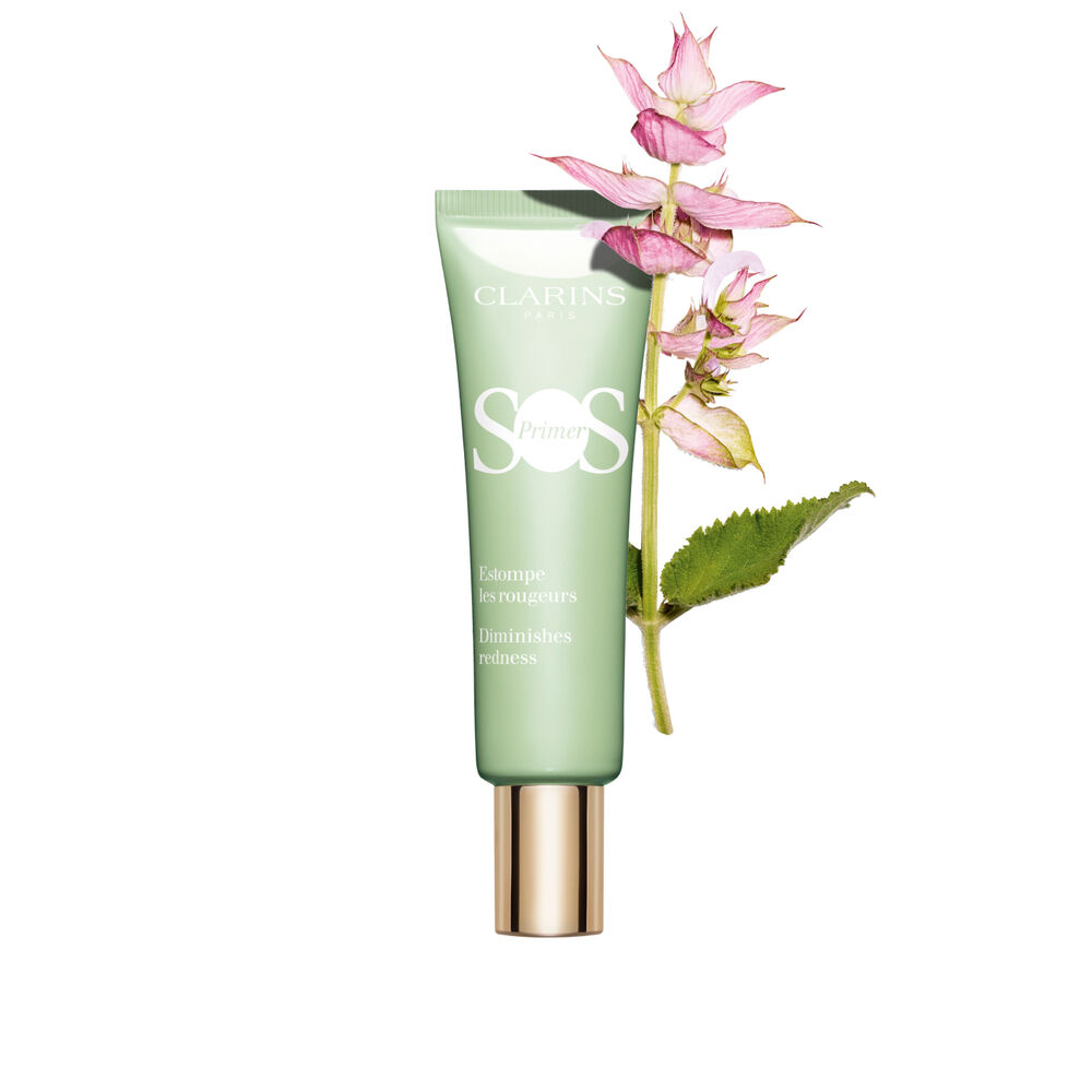 A tube of SOS Primer Green by Clarins to reduce the appearance of redness, with a branch of clary sage.