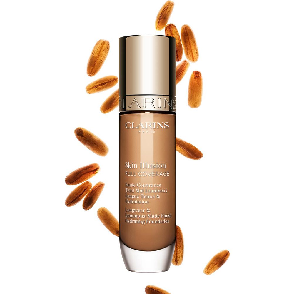 Clarins Skin Illusion Full Coverage showcasing its sleek design and vibrant packaging, the ideal foundation for a flawless & natural complexion.