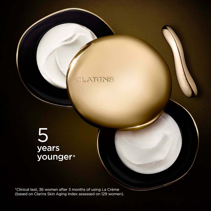 Clarins Precious Rich Cream on dark background, with text emphasising its power to make skin appear 5 years younger