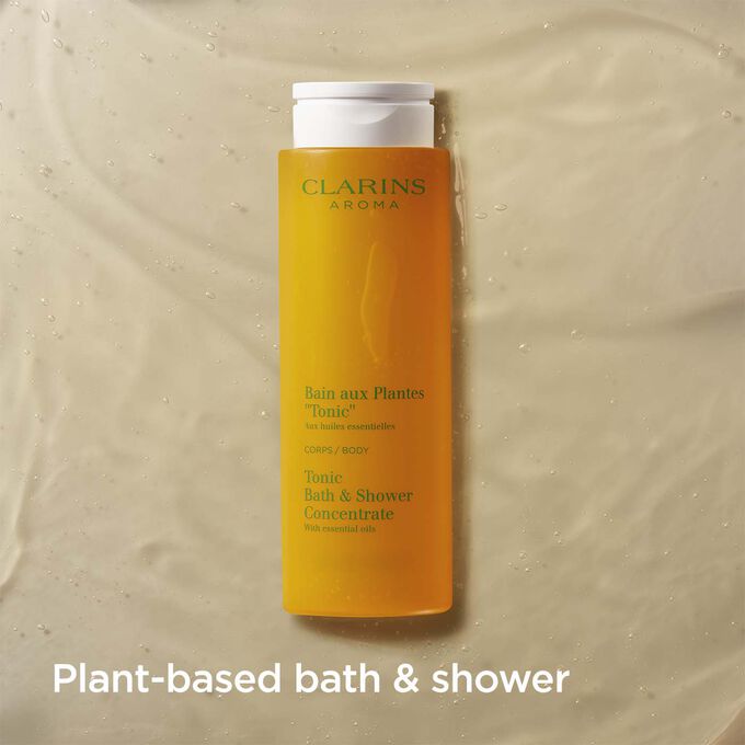 Packshot of Clarins Tonic Bath and Shower Concentrate with text emphasising it is a fragrant plant-based shower gel.