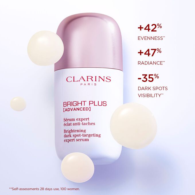 Close-up of Bright Plus Expert Serum with text highlighting its effects: enhancing radiance and reducing dark spots.