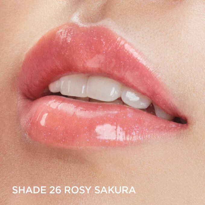 Focus on a woman's lips to show how lips look with Clarins Lip Comfort Oil in Rosy sakura, from the Fairy Blossoms range.