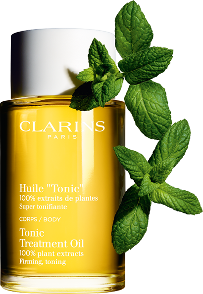 Bottle of tonic oil and mint leaves