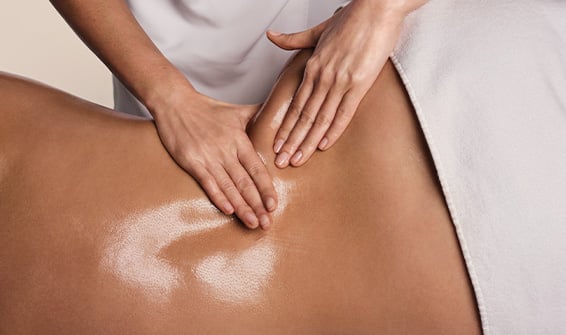 Clarins beauty therapist providing a body treatment